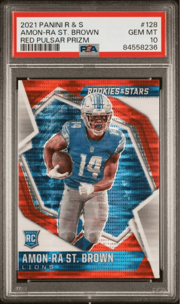 Graded 2021 Panini Rookies & Stars Amon-Ra St. Brown #128 Red Pulsar Prizm Rookie RC Football Card PSA 10 Gem Mint (ONLINE ORDER ONLY)