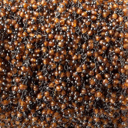2mm Hessonite Garnet microfaceted round Black Gold Dangling Chain by the foot (ONLINE ORDER ONLY)