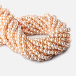 6-7mm Creamsicle Large Hole Off Round Freshwater Pearl 2.5mm drill hole, 15 inch, 75 pieces (ONLINE ORDER ONLY)