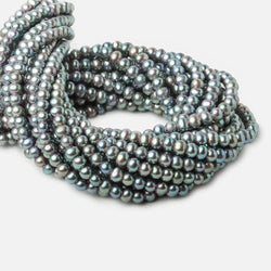 6x4-7x5mm Aqua Green Peacock 2.5mm Large Hole Off Round Pearl 15 inch 75 pieces (ONLINE ORDER ONLY)