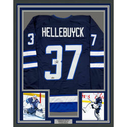 Framed Facsimile Autographed Connor Hellebuyck 35x39 Winnipeg Blue Reprint Laser Auto Hockey Jersey (ONLINE ORDER ONLY)