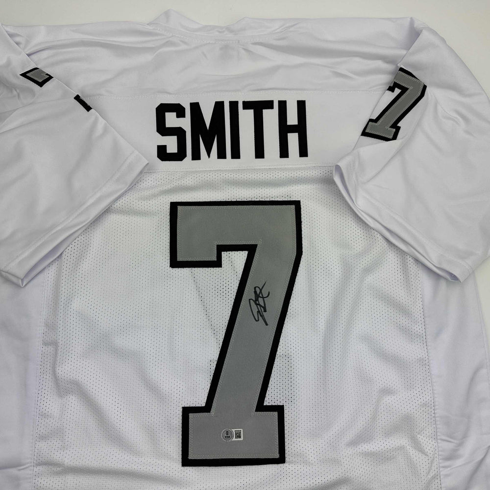 Autographed/Signed Geno Smith Oakland White Color Rush Football Jersey Beckett BAS COA (ONLINE ORDER ONLY)