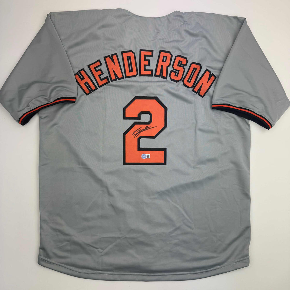Autographed/Signed Gunnar Henderson Baltimore Grey Baseball Jersey Beckett BAS COA (ONLINE ORDER ONLY)